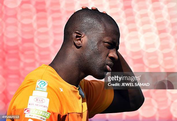Ivory Coast's midfielder Yaya Toure arrives for a training session at the Toyota Stadium in Frisco, Texas, on June 3 on the eve of their World Cup...