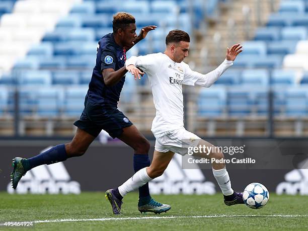 Borja Mayoral of Real Madrid duels for the ball with Felix Eboa Eboa of Paris Saint-Germain during the UEFA Youth League match between Real Madrid...