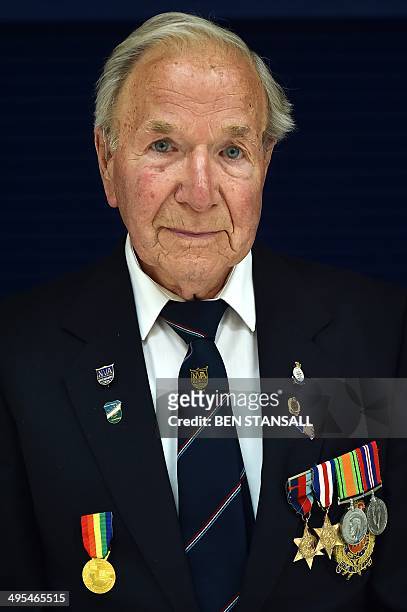 Day veteran Royal Engineer, Bob Stevens poses for pictures in Basildon, Essex on June 3, 2014 before embarking on a trip to France to commemorate the...