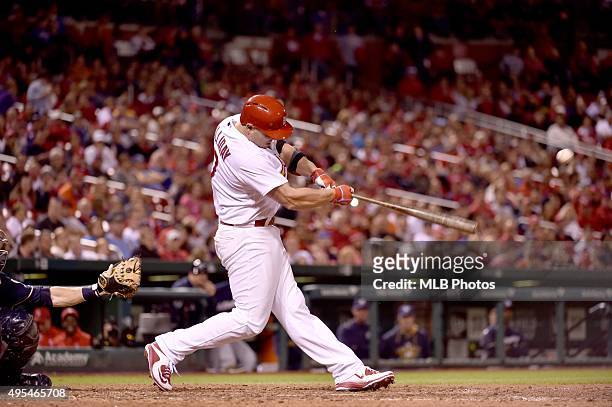 Matt Holliday of the St. Louis Cardinals gets a base hit for his 45th consecutive game on-base streak during an MLB game against the Milwaukee...