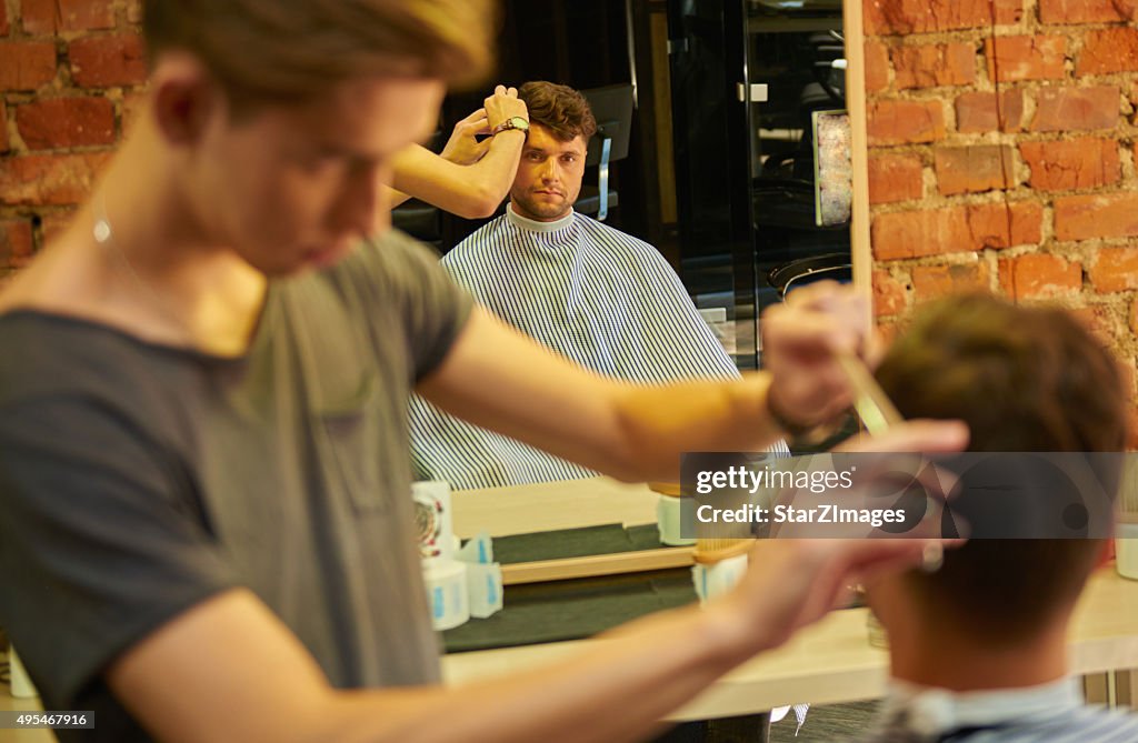 Barbers working in hair salon