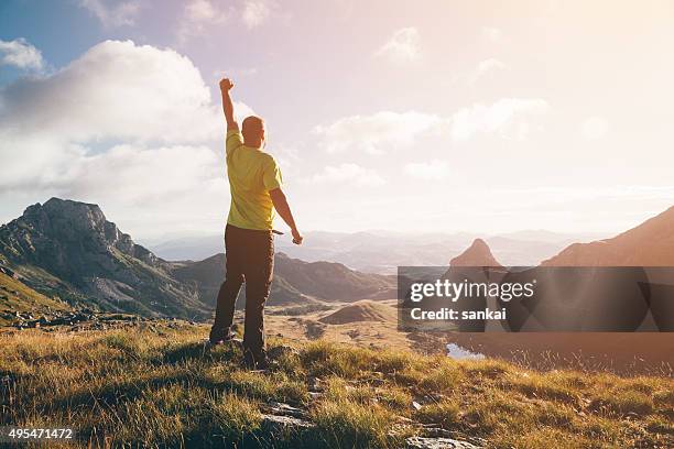 success, winner concept. man on top of the mountain. - be boundless summit stock pictures, royalty-free photos & images