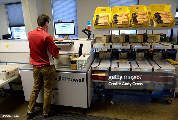 November 03: Joe Szuszwalak, elections support assistant, works the vote-by-mail sorting machine for the 2015 Denver Municipal Elections at the...