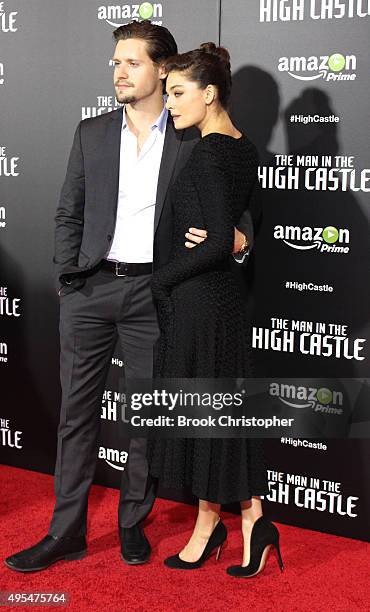 Luke Kleintank and Alexa Davalos attend "The Man In The High Castle" New York series premiere at Alice Tully Hall on November 2, 2015 in New York...