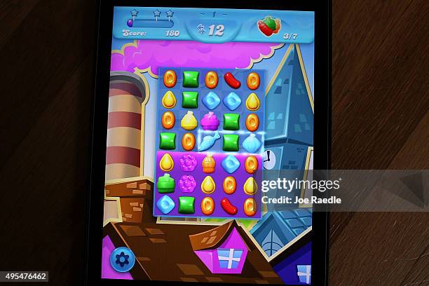 In this photo illustration, a Candy Crush game is seen on an iPad on November 3, 2015 in Miami, Florida. It was announced today that game maker...