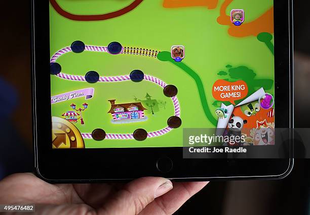 In this photo illustration, a Candy Crush game is seen on an iPad on November 3, 2015 in Miami, Florida. It was announced today that game maker...