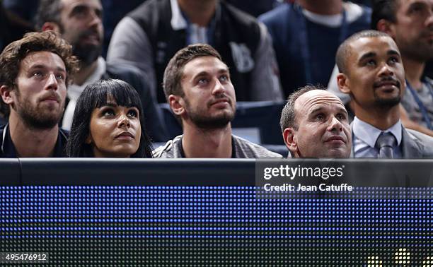 French singer Shy'm, girlfriend of French player Benoit Paire and his coach Lionel Zimbler attend Paire's match against Gael Monfils of France on Day...