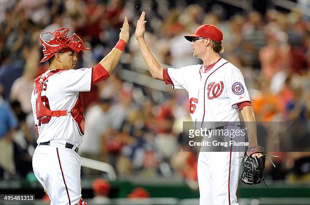 Tyler Clippard of the Washington Nationals celebrates with Wilson Ramos after a 7-0 victory against the Philadelphia Phillies at Nationals Park on...
