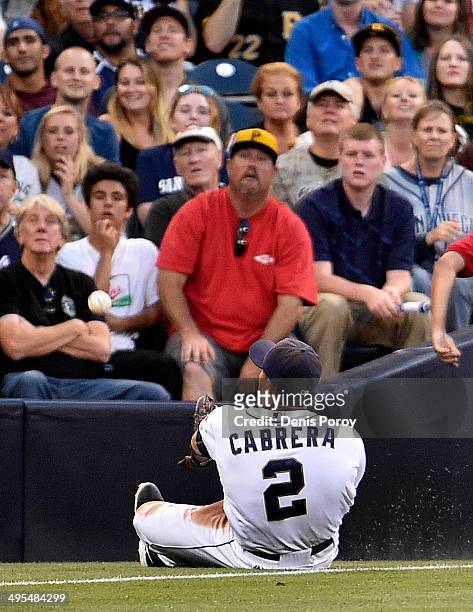 Everth Cabrera of the San Diego Padres slides but can't make the catch on a foul ball hit by Travis Snider of the Pittsburgh Pirates during the...