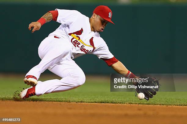 Kolten Wong of the St. Louis Cardinals fields a ground ball in the eighth inning against the Kansas City Royals at Busch Stadium on June 3, 2014 in...