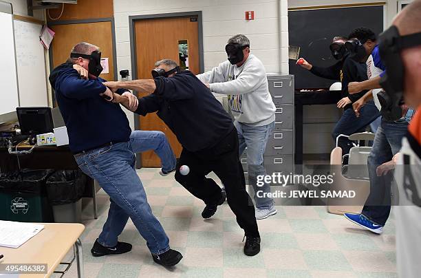 An "active shooter " is tackled during ALICE training at the Harry S. Truman High School in Levittown, Pennsylvania, on November 3, 2015. ALICE is...