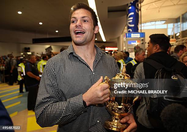 All Blacks captain Richie McCaw arrives back home with the Rugby World Cup trophy at the Auckland Airport in Auckland on November 04, 2015. The New...