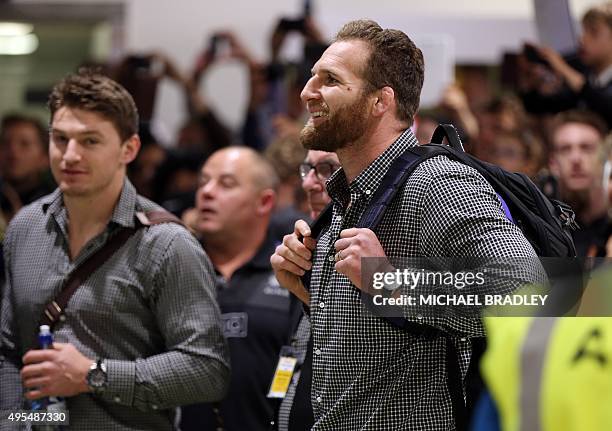 All Blacks Kieran Read arrives back home with the Rugby World Cup trophy at the Auckland Airport in Auckland on November 04, 2015. The New Zeland All...