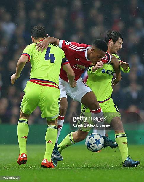 Anthony Martial of Manchester United battles with Sergey Ignashevich and Alan Dzagoev of CSKA Moscow during the UEFA Champions League Group B match...