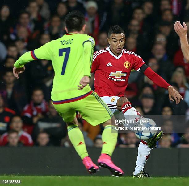 Jesse Lingard of Manchester United in action with Zoran Tosic of CSKA Moscow during the UEFA Champions League match between Manchester United and...