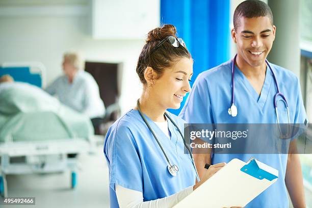 two young nurses on the ward - confidence course stockfoto's en -beelden