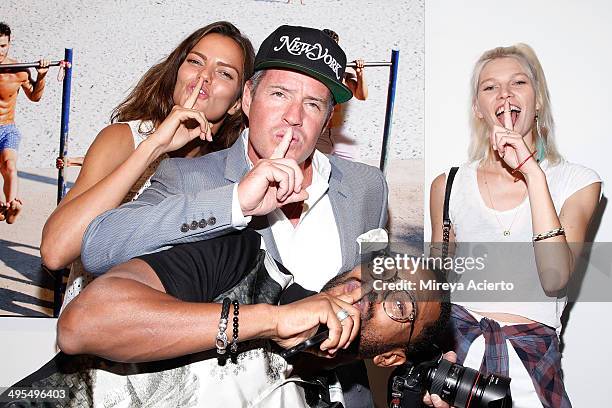 Barbara Fialho, Ben Watts, Maxwell and Aline Weber attend the GQ and Ben Watts Photo Exhibition celebrating the June issue and The World Cup at Milk...