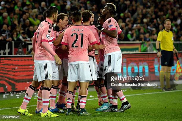 Stephan Lichtsteiner of Juventus celebrates with team mates after scoring his team's first goal during the UEFA Champions League group stage match...