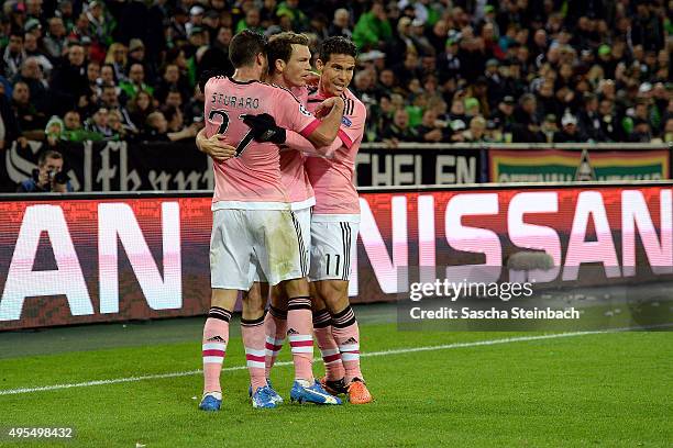 Stephan Lichtsteiner of Juventus celebrates with team mates after scoring his team's first goal during the UEFA Champions League group stage match...