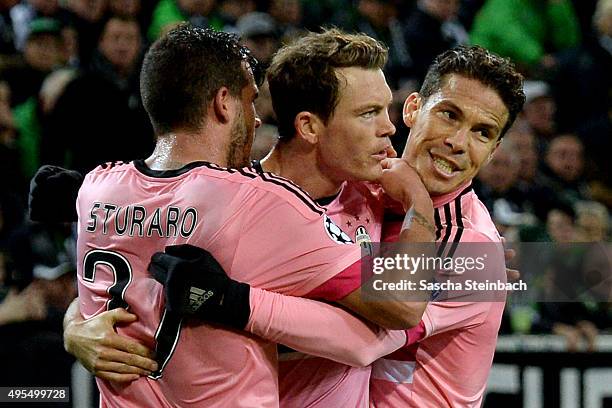 Stephan Lichtsteiner of Juventus celebrates with team mates after scoring his team's first goal during the UEFA Champions League group stage match...