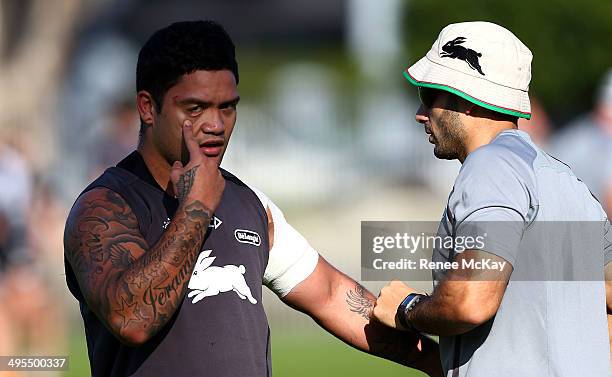 Issac Luke pulls a face as his shoulder is strapped during a South Sydney Rabbitohs NRL training session at Redfern Oval on June 4, 2014 in Sydney,...