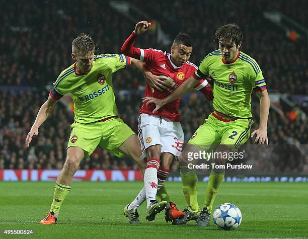 Jesse Lingard of Manchester United in action with Pontus Wernbloom and Mario Fernandes of CSKA Moscow during the UEFA Champions League match between...