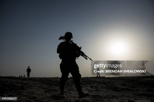 Soldiers patrol near Kandahar Airfield on June 3, 2014. Members of the 1st Battalion, 12th Regiment, 4th Brigade Combat Team, 4th Infantry Division...