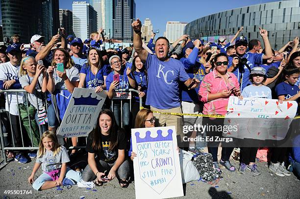 Fans cheer for members of the Kansas City Royals during a parade to celebrate the Royals' World Series victory on November 3, 2015 in Kansas City,...