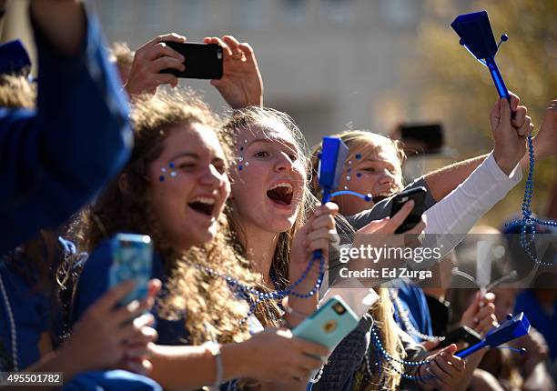 Fans cheer for members of the Kansas City Royals during a parade to celebrate the Royals' World Series victory on November 3, 2015 in Kansas City,...