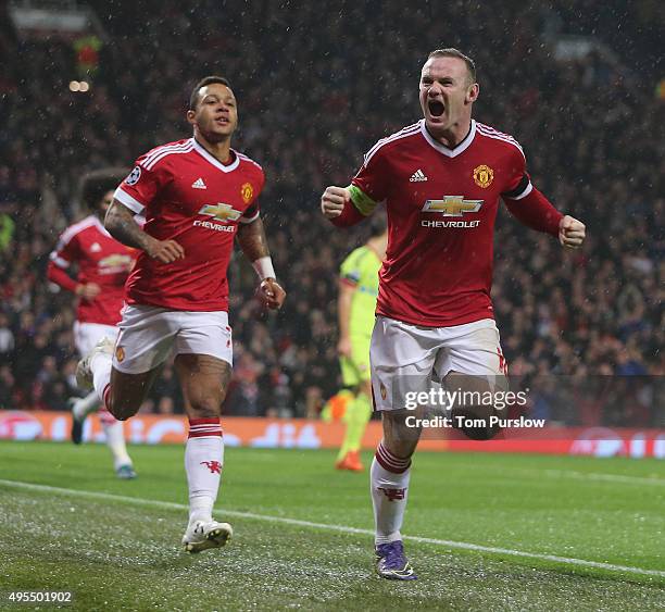 Wayne Rooney of Manchester United celebrates scoring their first goal during the UEFA Champions League match between Manchester United and CSKA...