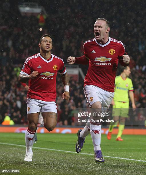 Wayne Rooney of Manchester United celebrates scoring their first goal during the UEFA Champions League match between Manchester United and CSKA...