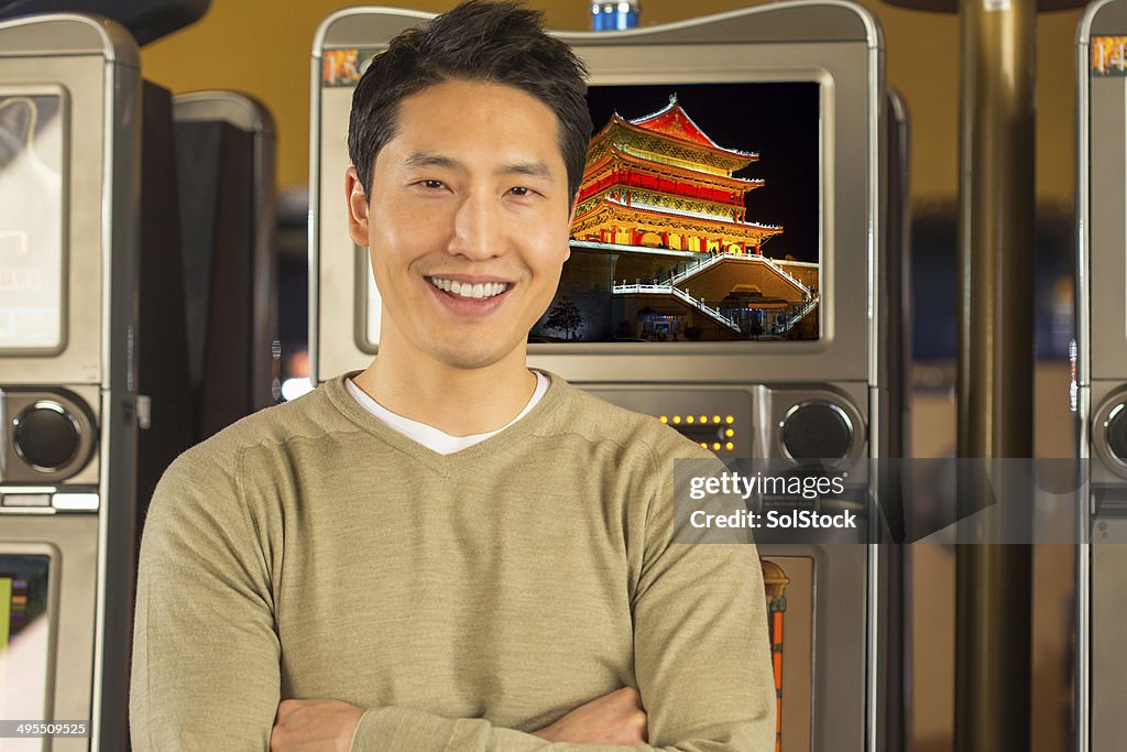 Man infront of a Slot Machine