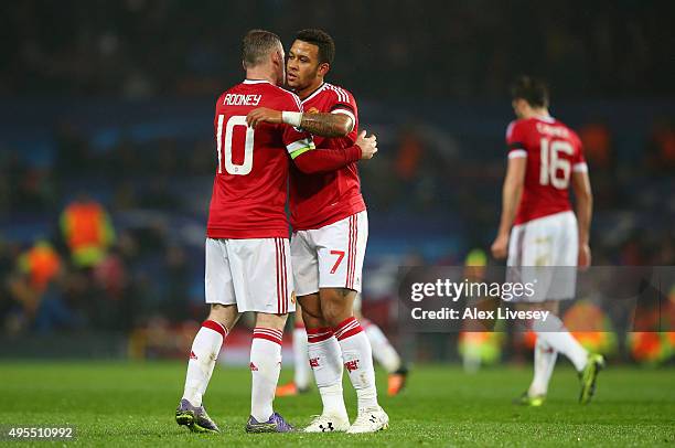 Wayne Rooney and Memphis Depay of Manchester United embrace at the final whistle during the UEFA Champions League Group B match between Manchester...