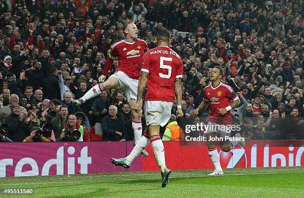 Wayne Rooney of Manchester United celebrates scoring their first goal during the UEFA Champions League match between Manchester United and CSKA...