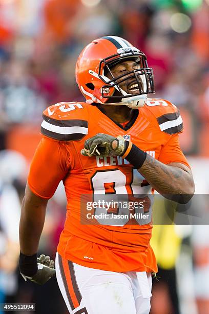 Outside linebacker Armonty Bryant and free safety Tashaun Gipson of the Cleveland Browns celebrate after a play during the second half at FirstEnergy...