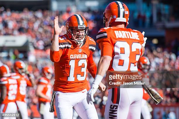 Quarterback Josh McCown celebrates with wide receiver Brian Hartline of the Cleveland Browns after a touchdown during the first half at FirstEnergy...