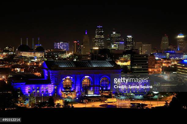 Union Station is lit up with blue lights in front of the Kansas City skyline ahead of a parade and celebration in honor of the Kansas City Royals'...