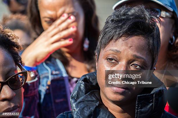 Tenesha Reed, mother of Demarius Reed reacts as Father Michael L. Pfleger of Saint Sabina church talks during a visit to the site were Tyshawn Lee...