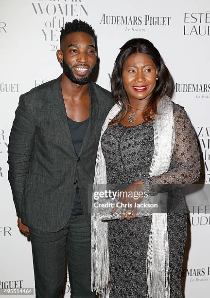 Singer Tinie Tempah and his mother Rosemary Okogwu attend Harper's Bazaar Women of the Year Awards at Claridge's Hotel on November 3, 2015 in London,...