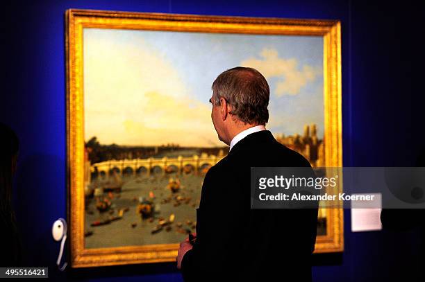 Prince Andrew, Duke of York, is pictured standing in front a painting during his tour inside the State Museum of Lower Saxony on June 04, 2014 in...