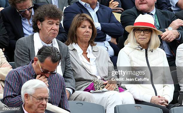 Robert Charlebois, his wife Laurence Charlebois and Mireille Darc attend Day 10 of the French Open 2014 held at Roland-Garros stadium on June 3, 2014...