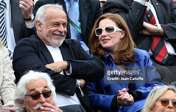 Francis Perrin and his wife Gersende Perrin attend Day 10 of the French Open 2014 held at Roland-Garros stadium on June 3, 2014 in Paris, France.
