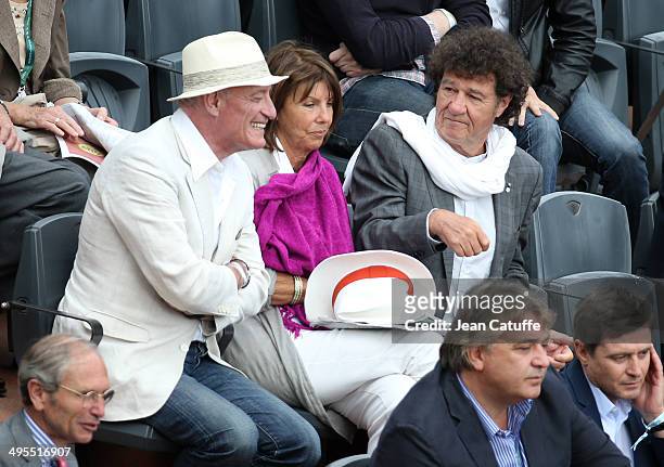 Pascal Desprez, husband of Mireille Darc, Laurence Charlebois and husband Robert Charlebois attend Day 10 of the French Open 2014 held at...