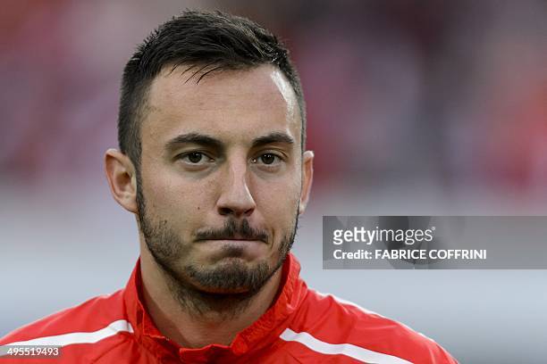 Switzerland's forward Josip Drmic listens to the national anthem prior to a friendly football match between Switzerland and Peru on June 3 in...