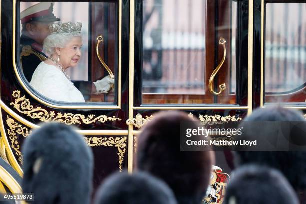 Queen Elizabeth II leaves Buckingham Palace to attend the State Opening of Parliament on June 4, 2014 in London, England. Queen Elizabeth II will...