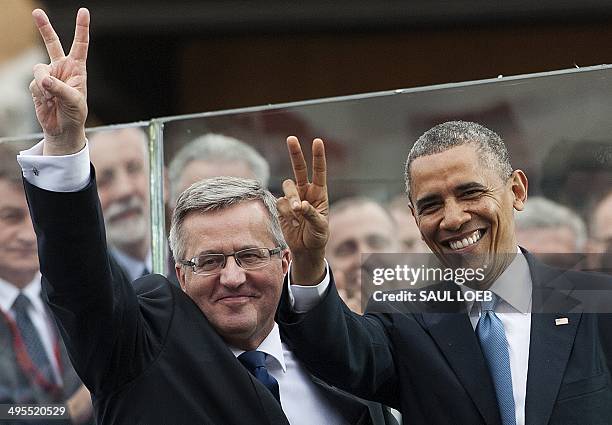 Polish President Bronislaw Komorowski and US President Barack Obama gesture as they attend the 25th Anniversary Freedom Day Event in honor of the...