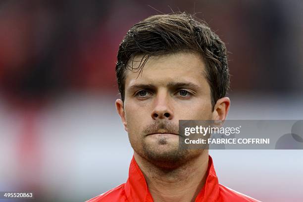 Switzerland's midfielder Valentin Stocker listens to the national anthem prior to a friendly football match between Switzerland and Peru on June 3 in...