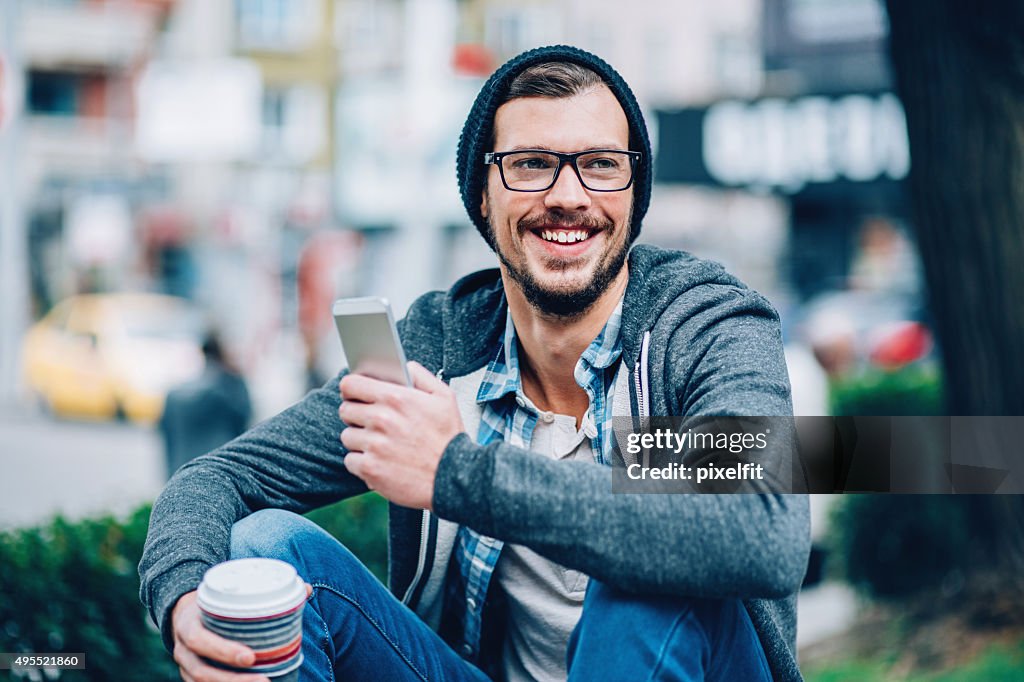 Man with phone outdoors