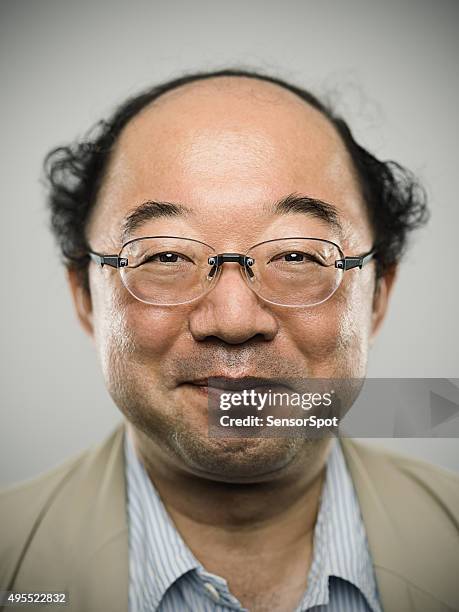 portrait of a real happy japanese man with black hair. - fat asian man stockfoto's en -beelden