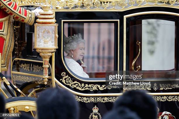 Queen Elizabeth II returns to Buckingham Palace in the new Diamond Jubilee state coach following the State Opening of Parliament on June 4, 2014 in...